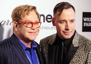 John and Furnish pose at the 2014 Elton John AIDS Foundation Oscar Party in West Hollywood