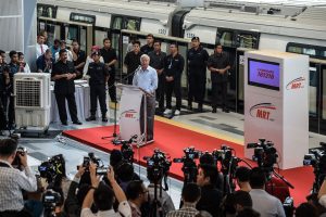 Malaysia's Prime Minister Najib Razak (C) delivers his speach during the phase one launching of the Malaysia Mass Rapid Transit (MYMRT) at the Kwasa Damansara station in Sungai Buloh, on the outskirts of Kuala Lumpur on December 15, 2016.
Mass Rapid Transit Corporation Sdn Bhd (MRT Corp) launched its first phase of Malaysia Mass Rapid Transit from Sungai Buloh to Kajang, which runs for 21 kilometres starting at Sungai Buloh Station and ending at Semantan Station. The service will be open to public on December 16. / AFP PHOTO / MOHD RASFAN####################MOHD RASFAN