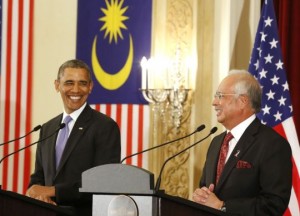 U.S. President Barack Obama and Malaysian Prime Minister Najib Razak both smile as they participate in a joint news conference at the Perdana Putra Building in Putrajaya, Malaysia, April 27, 2014. REUTERS/Larry Downing (MALAYSIA - Tags: POLITICS TPX IMAGES OF THE DAY)